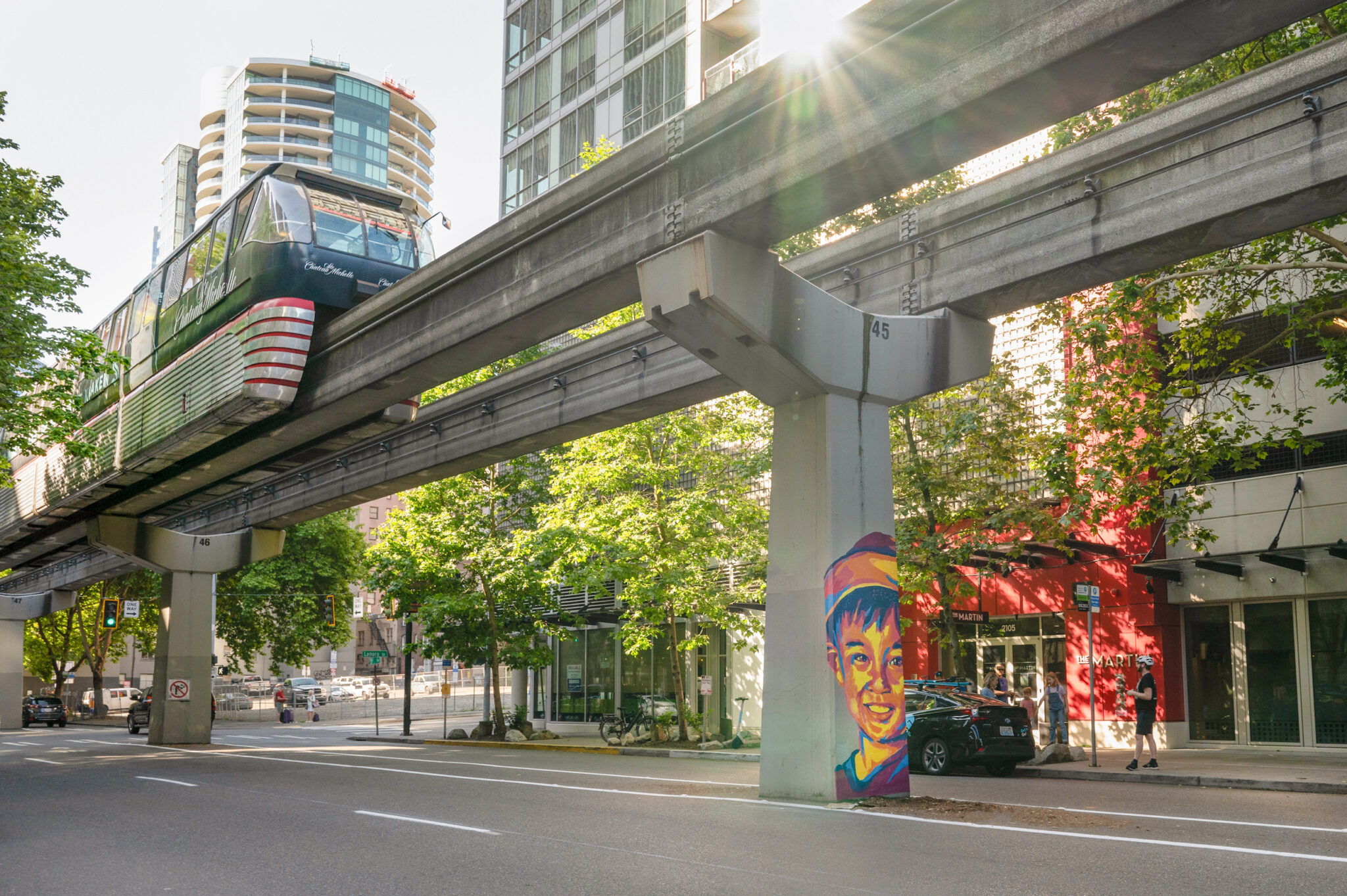 Seattle Sports fan mural with monorail train running overhead